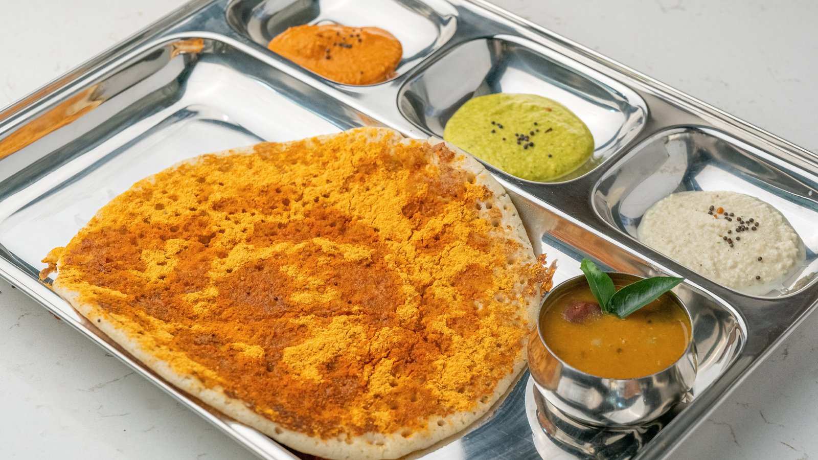 Spiced Podi Uttapam with lentil powder served at Sangam Vegetarian Restaurant