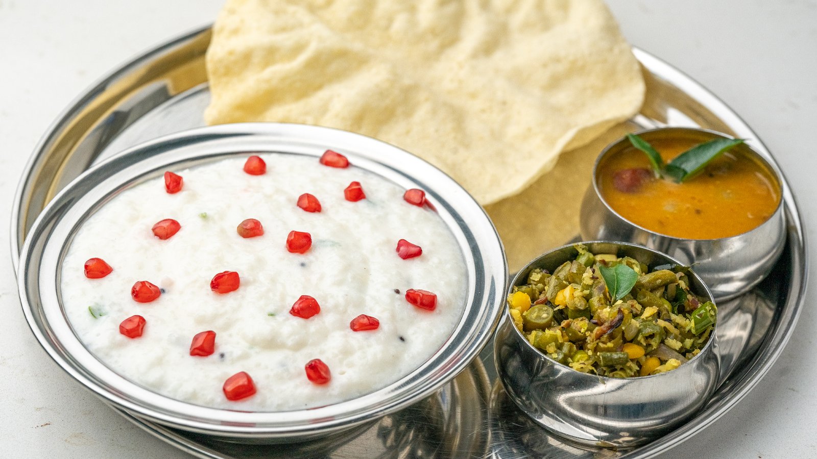 Creamy Curd Rice with yogurt and tempered spices served at Sangam Vegetarian Restaurant