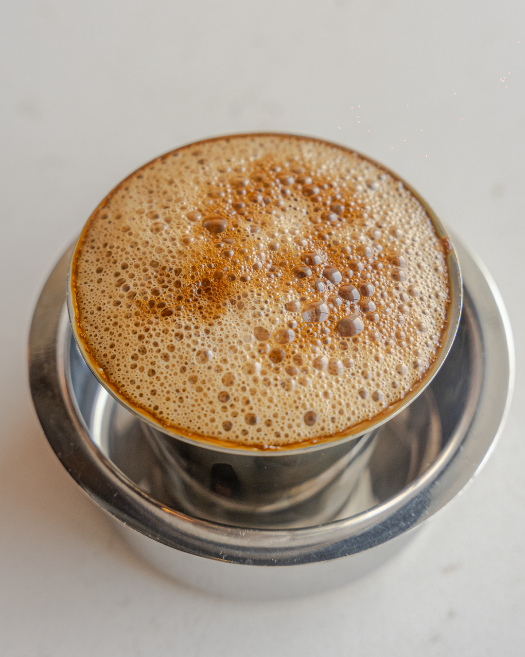 Freshly brewed South Indian Filter Coffee served at Sangam Vegetarian Restaurant
